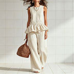 Women's sleeveless pleated vest and wide-leg pants streetwear set by FitiqueFit, showcasing stylish two-piece fashion ensemble.