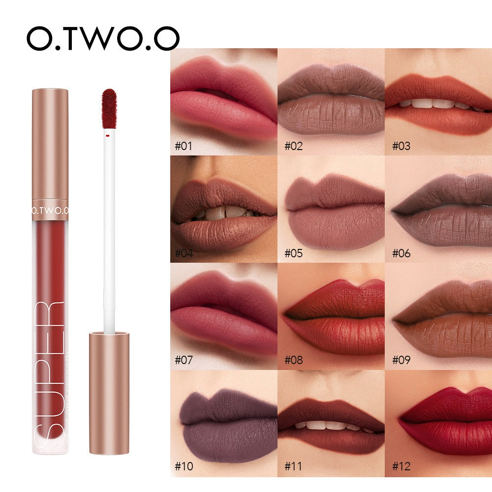O.TWO.O liquid lipstick with rose gold cap and clear tube, alongside swatches of 12 matte shades on lips.