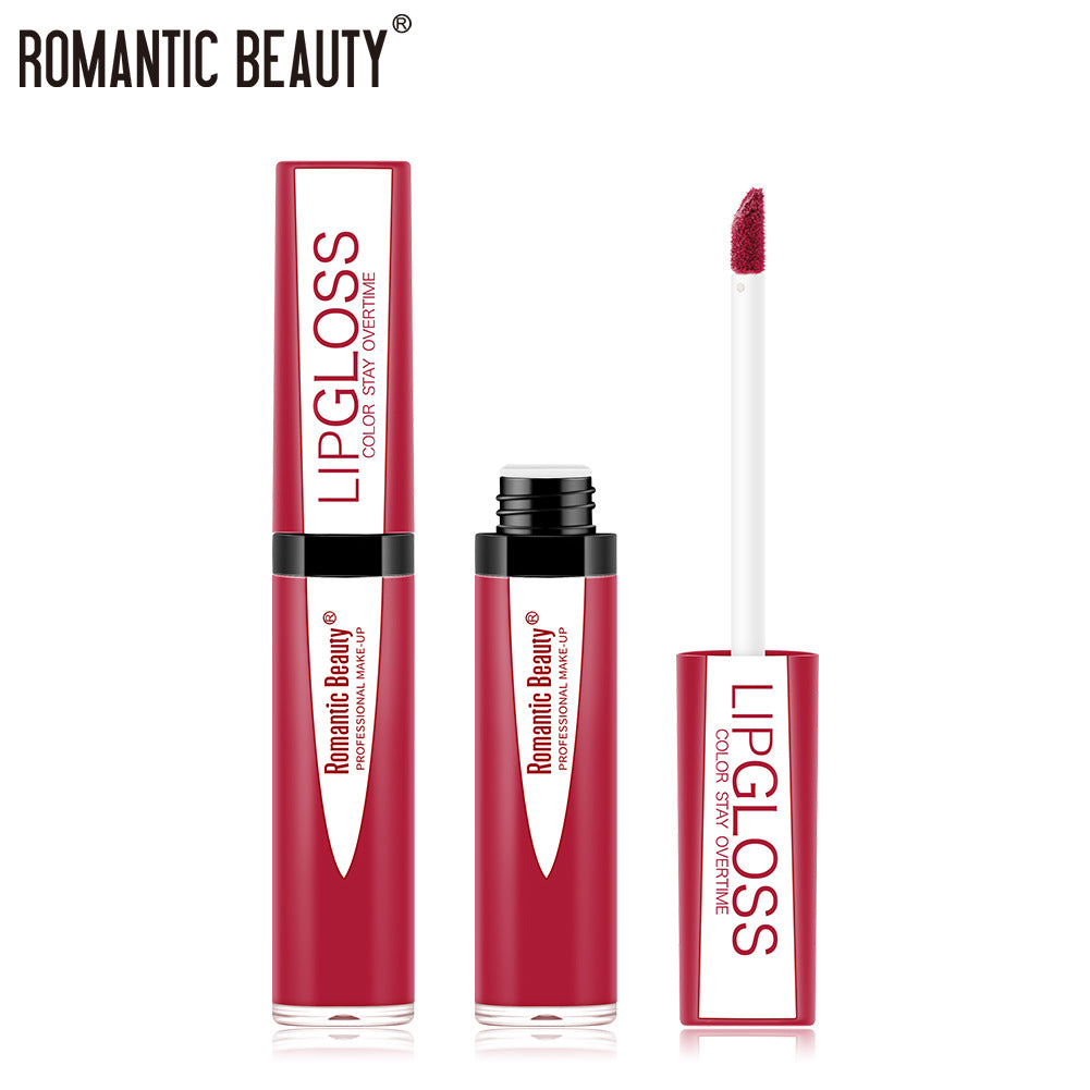Romantic Beauty Lipgloss in magenta with white text, shown closed and open with a dark pink doe-foot applicator.