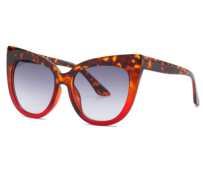 Women's oversized cat eye sunglasses with UV400 protection by Plush Fashion Hub, stylish eyewear with bold, rounded frames.