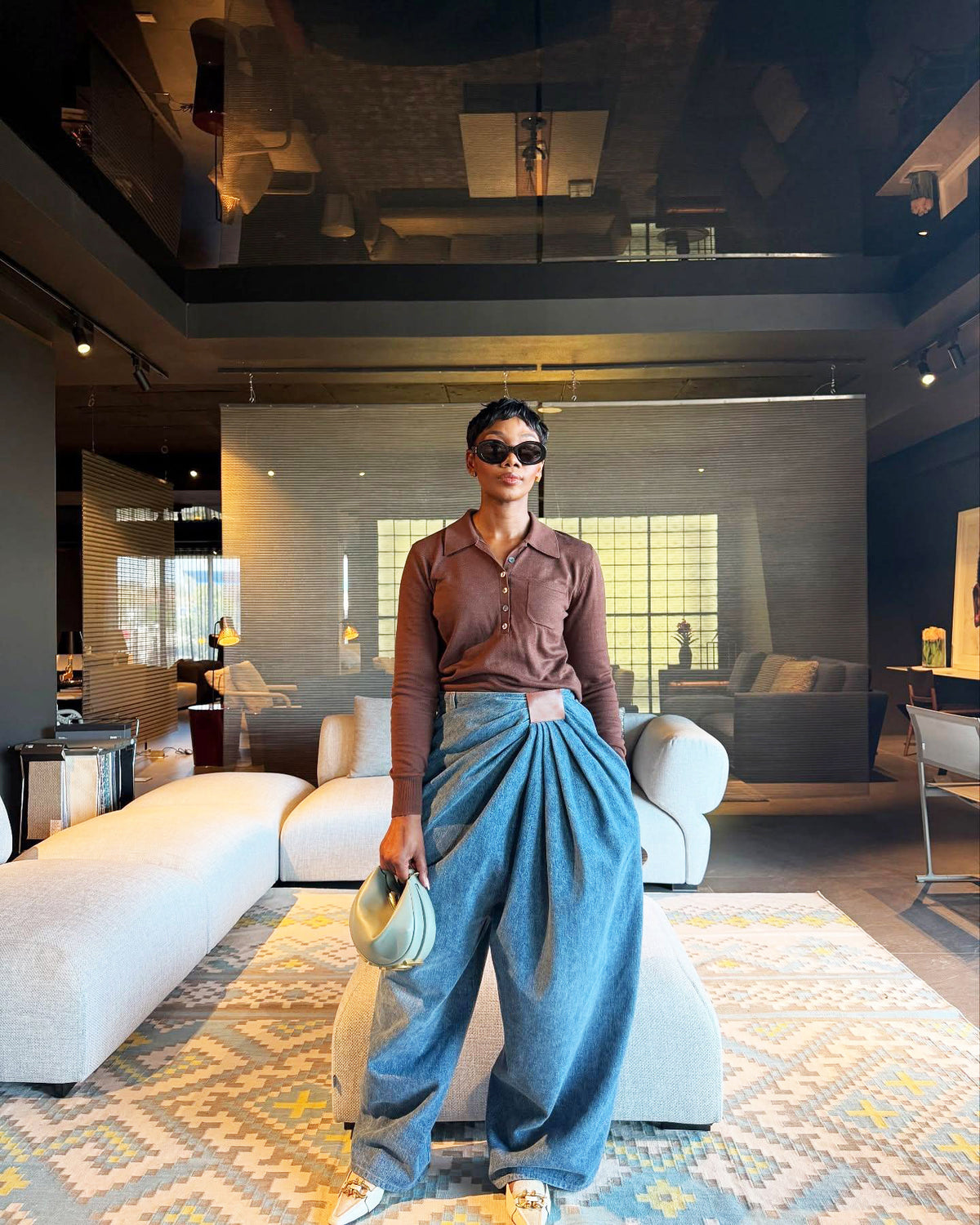 Asymmetric black PU high-waisted wide-leg jeans with flowing style, street fashion pants by eprolo, shown from the front.