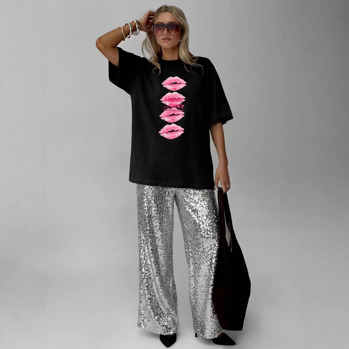 Women’s black cotton T-shirt with a lip print, short sleeves, loose fit, from Plush Fashion Hub.