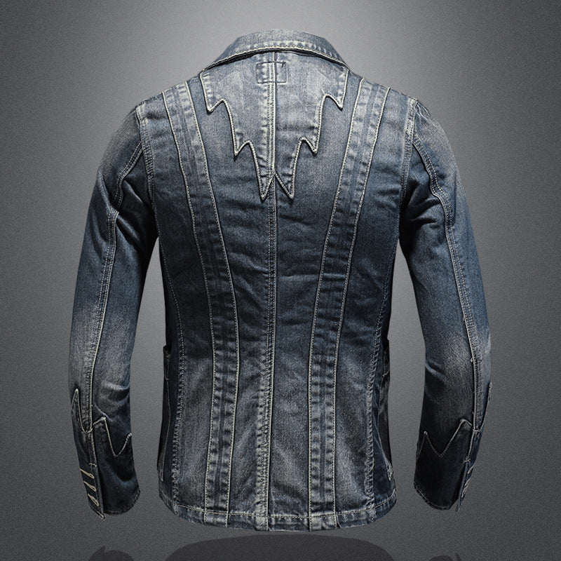 Blue denim blazer with vertical panel seams, distressed finish, and pointed back yoke detail.