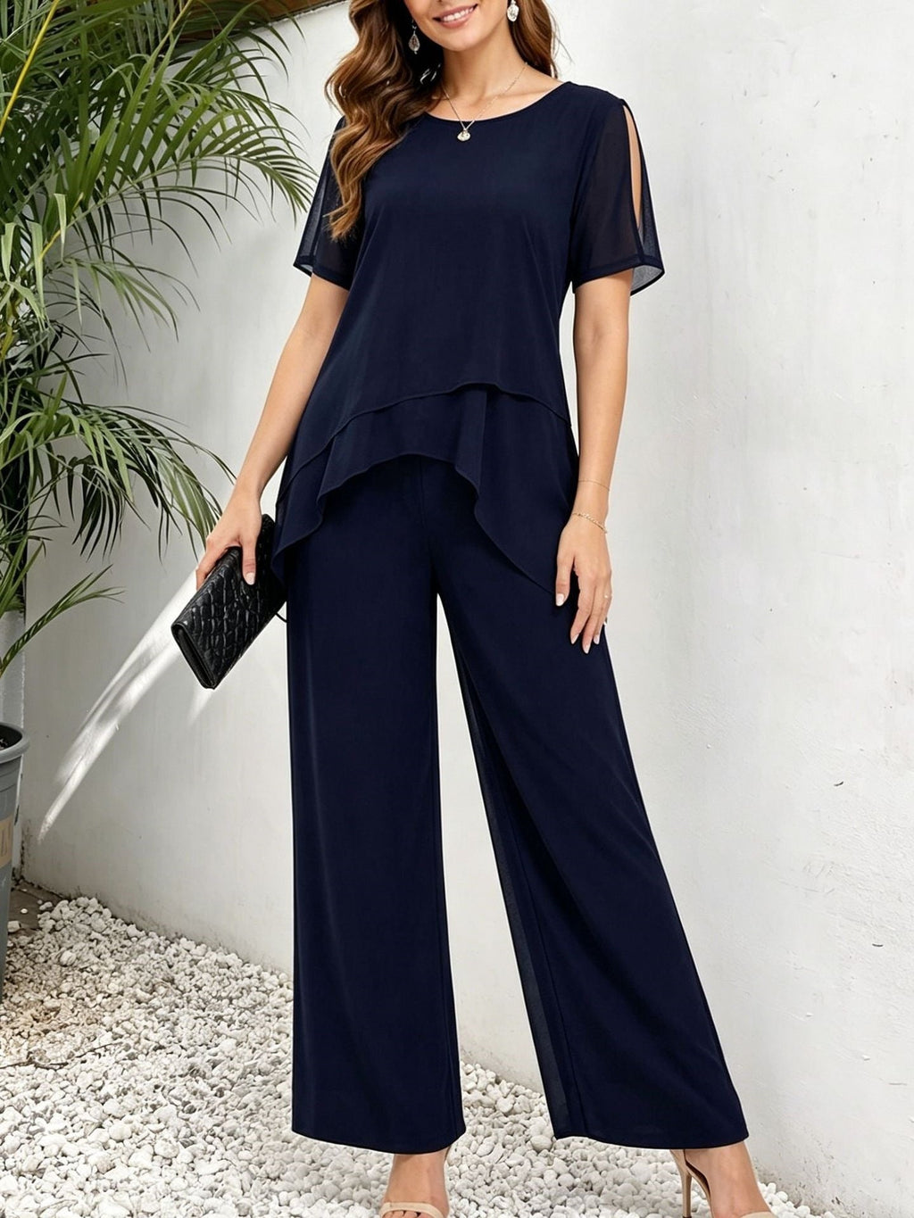 Women's two-piece matching set with an irregular hem top and wide-leg pants from FitiqueFit, shown in a stylish, coordinated outfit.