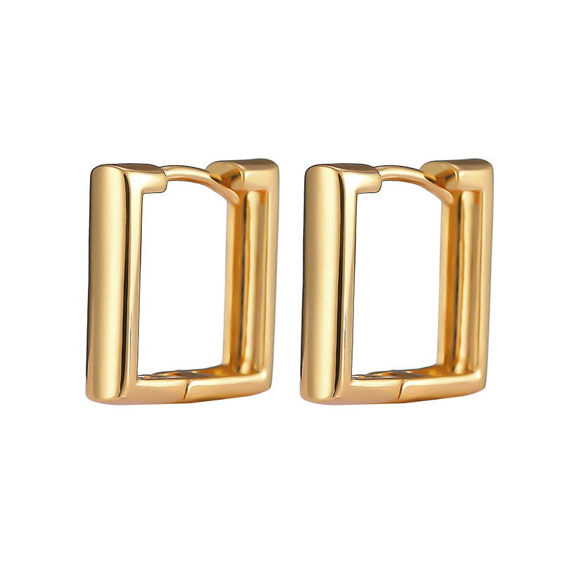 Gold square metal hoop earrings in a minimalist style with hinged closures against a white background.