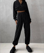 Women's high collar fleece sweatsuit from Plush Fashion Hub, cozy two-piece lounge set with a stylish fleece sweater and matching pants.