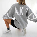 Oversized graphic print long sleeve sweatshirt by Plush Fashion Hub, featuring cozy urban style and thick, loose-fit design.