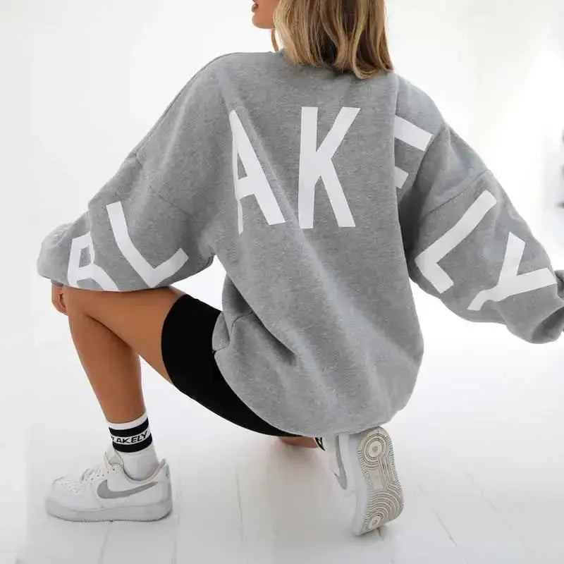 Oversized graphic print long sleeve sweatshirt by Plush Fashion Hub, featuring cozy urban style and thick, loose-fit design.