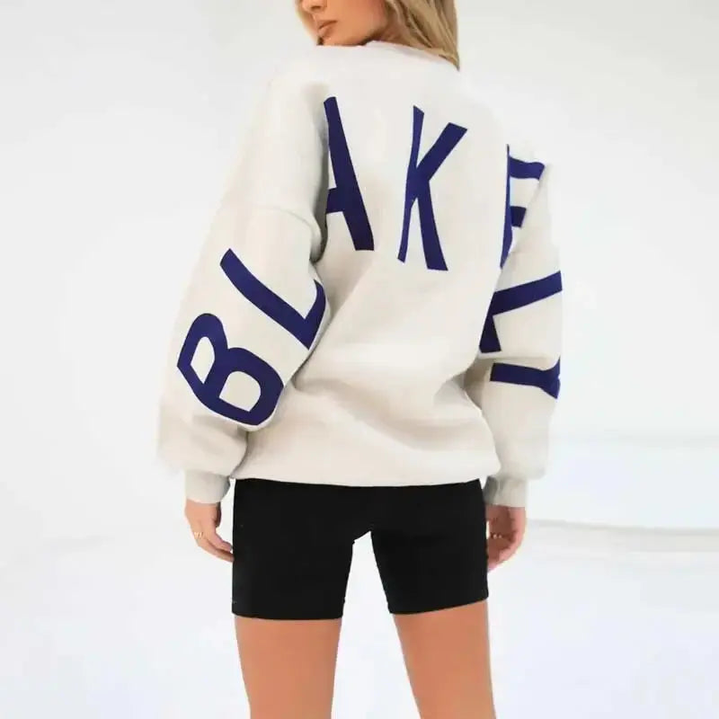 Oversized graphic print long sleeve sweatshirt by Plush Fashion Hub, cozy urban pullover with a bold printed design and thick fabric.