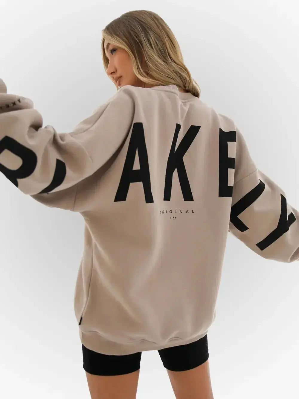 Oversized graphic print long sleeve sweatshirt from Plush Fashion Hub, featuring a cozy urban design and relaxed fit.