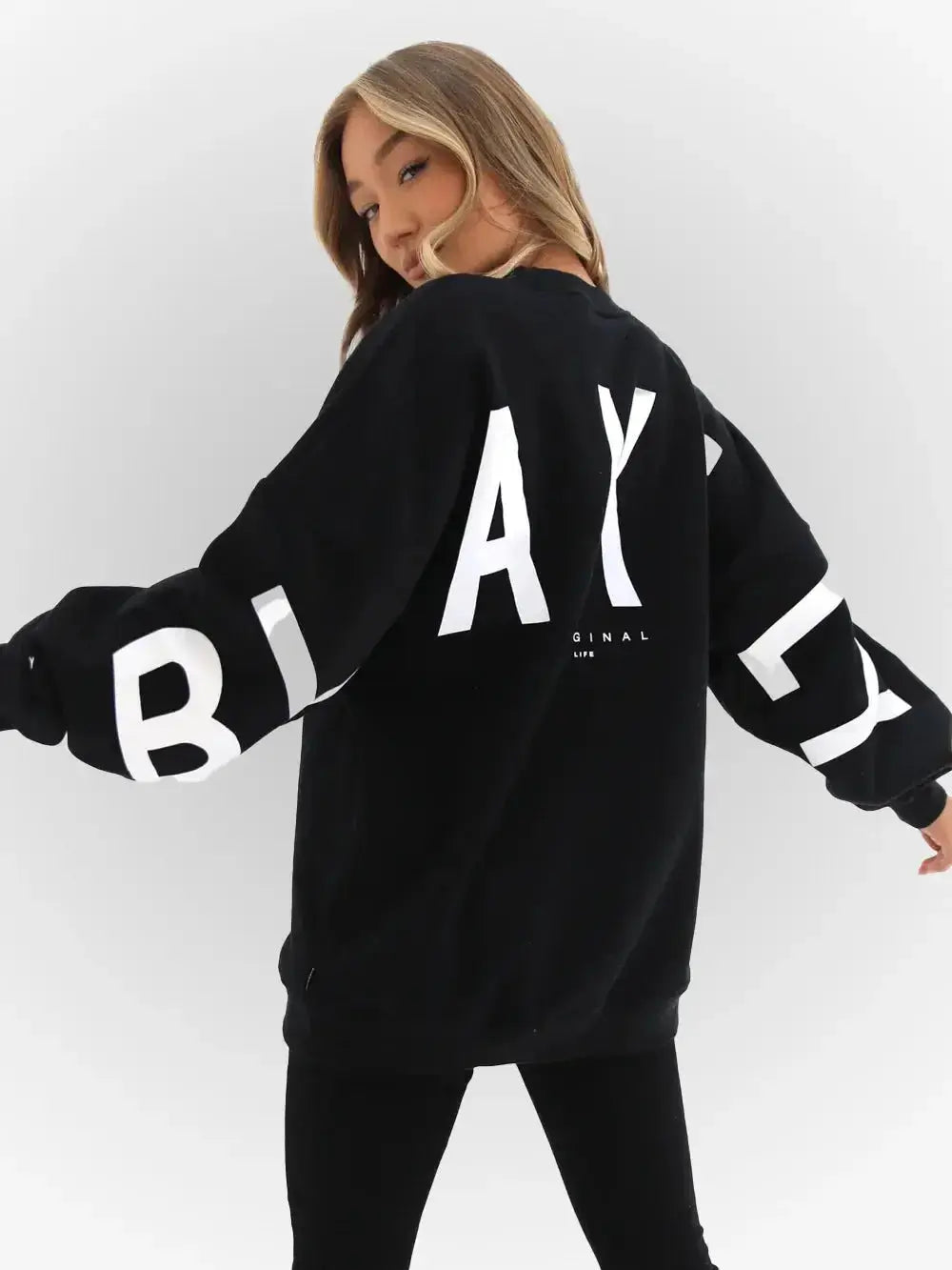 Oversized graphic print long sleeve sweatshirt by Plush Fashion Hub, cozy urban pullover with a bold urban print design.