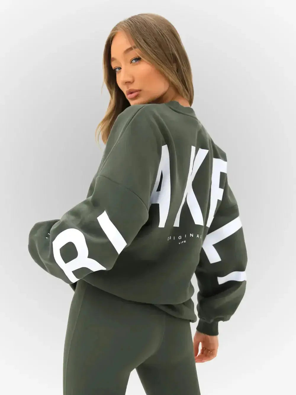 Oversized graphic print long sleeve sweatshirt from Plush Fashion Hub, cozy urban pullover with bold design and thick material.