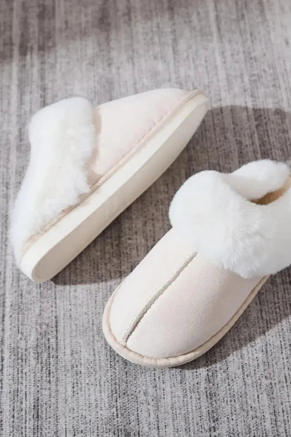 Soft plush faux fur women's indoor slippers with round toes from Plush Fashion Hub, perfect for cozy housewear.