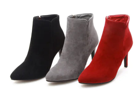 Women's black pointed toe ankle boots with super high heels from Trendy Attic Store01, showcasing sleek design and stylish silhouette.