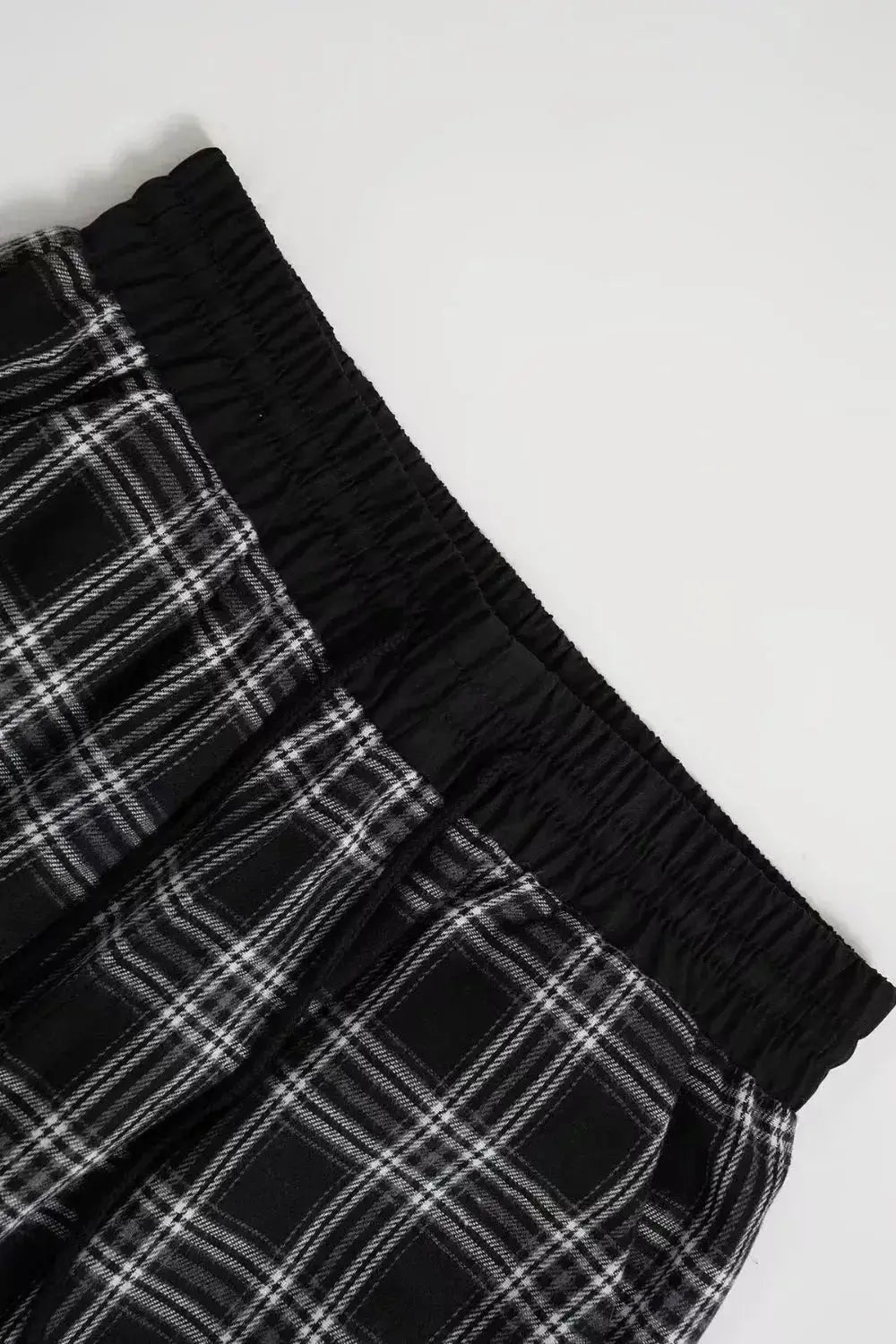 Women's high-waisted flannel plaid wide-leg trousers by Plush Fashion Hub, showing cozy, stylish pants with a classic plaid pattern.