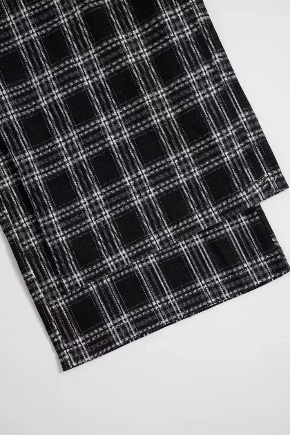 Women's high-waisted flannel plaid wide-leg trousers by Plush Fashion Hub, featuring a cozy flannel fabric and relaxed fit.