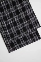 Women's high-waisted flannel plaid wide-leg trousers by Plush Fashion Hub, featuring a cozy flannel fabric and relaxed fit.