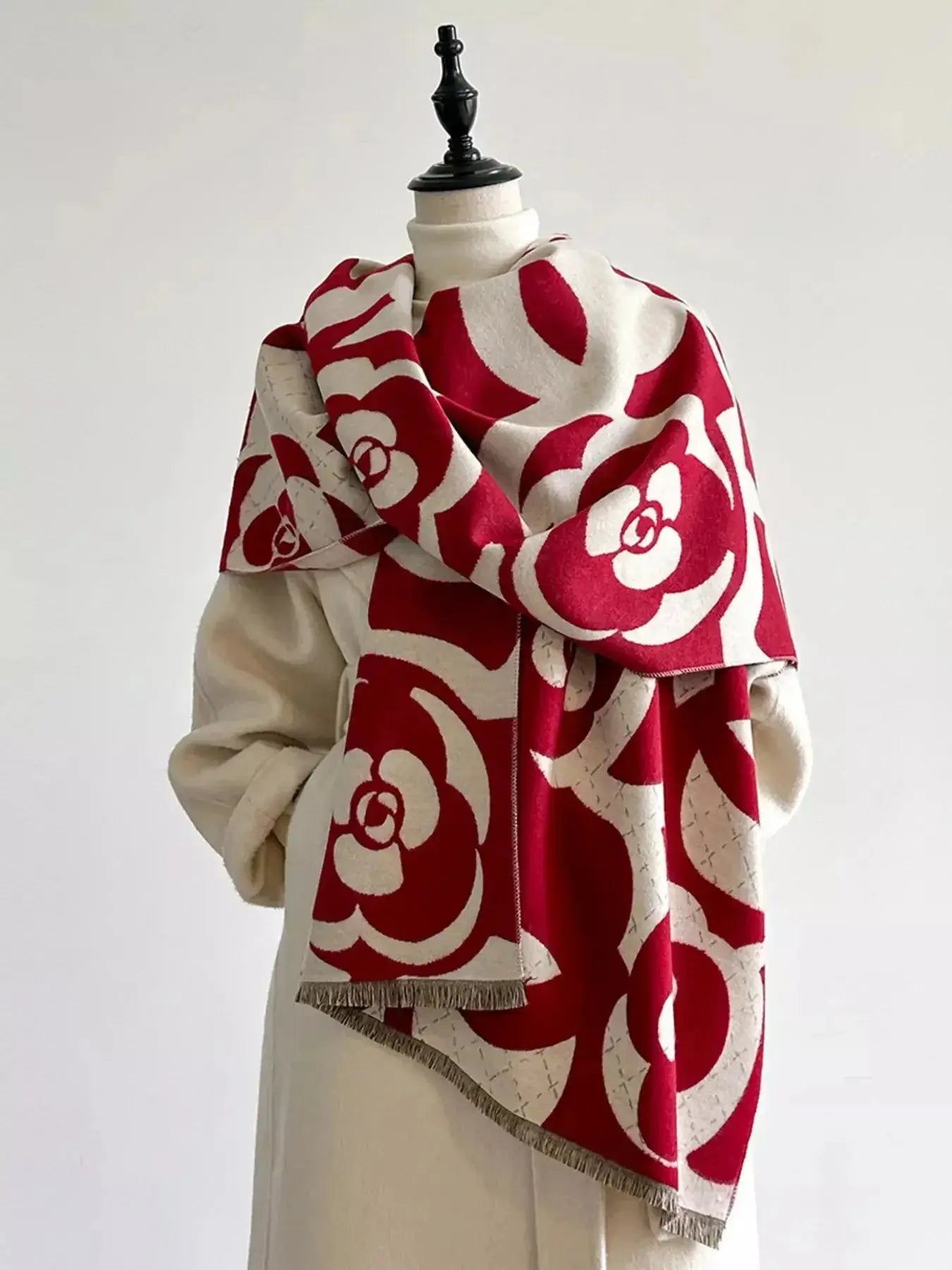 Floral patterned winter scarf from Plush Fashion Hub, soft and cozy accessory for autumn and winter warmth.