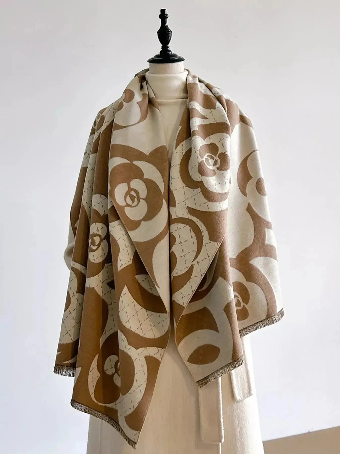 Floral patterned winter scarf from Plush Fashion Hub, soft and cozy accessory for autumn and winter warmth.