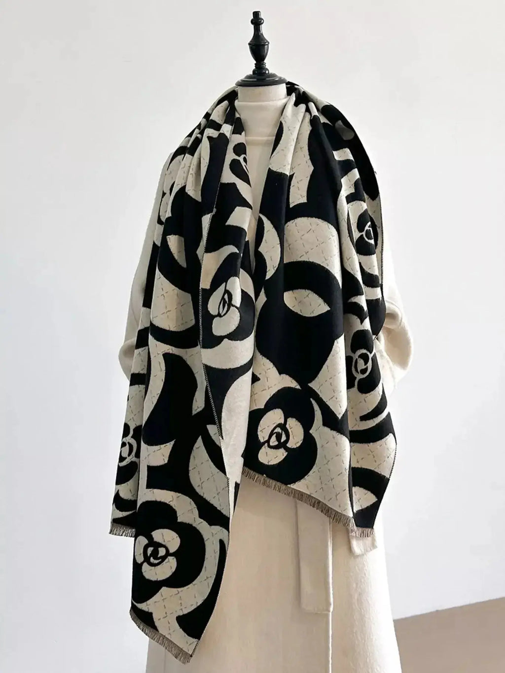 Floral patterned winter scarf from Plush Fashion Hub, soft cozy accessory for warmth during autumn and winter.