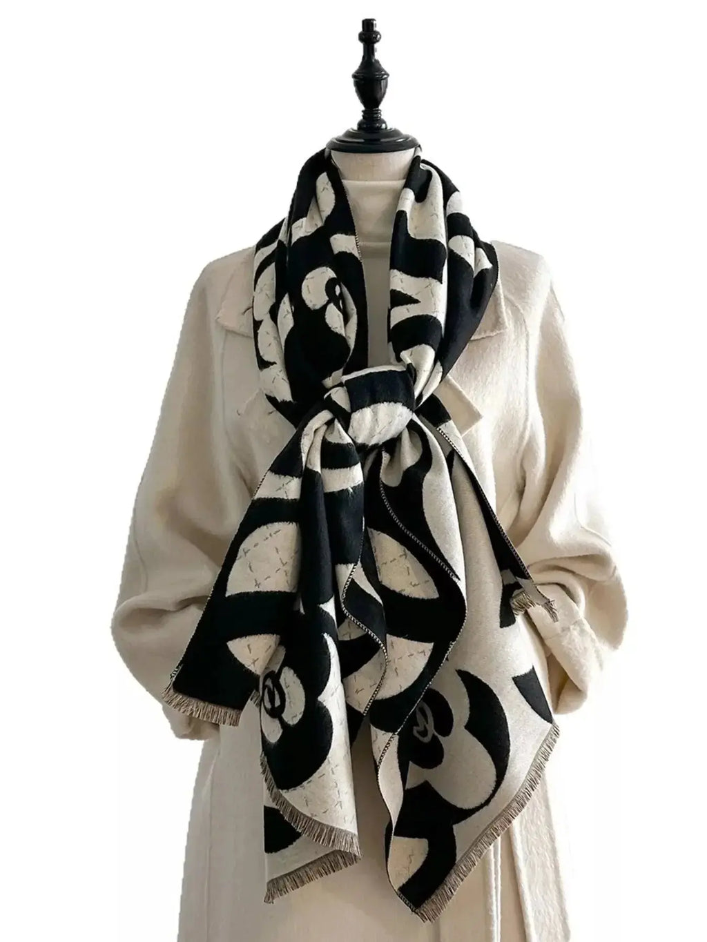 Floral patterned winter scarf by Plush Fashion Hub, soft and cozy for autumn and winter warmth, shown in close-up.