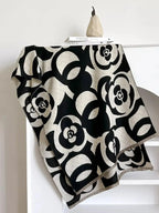 Floral patterned winter scarf from Plush Fashion Hub, soft cozy warm accessory for autumn and winter seasons.