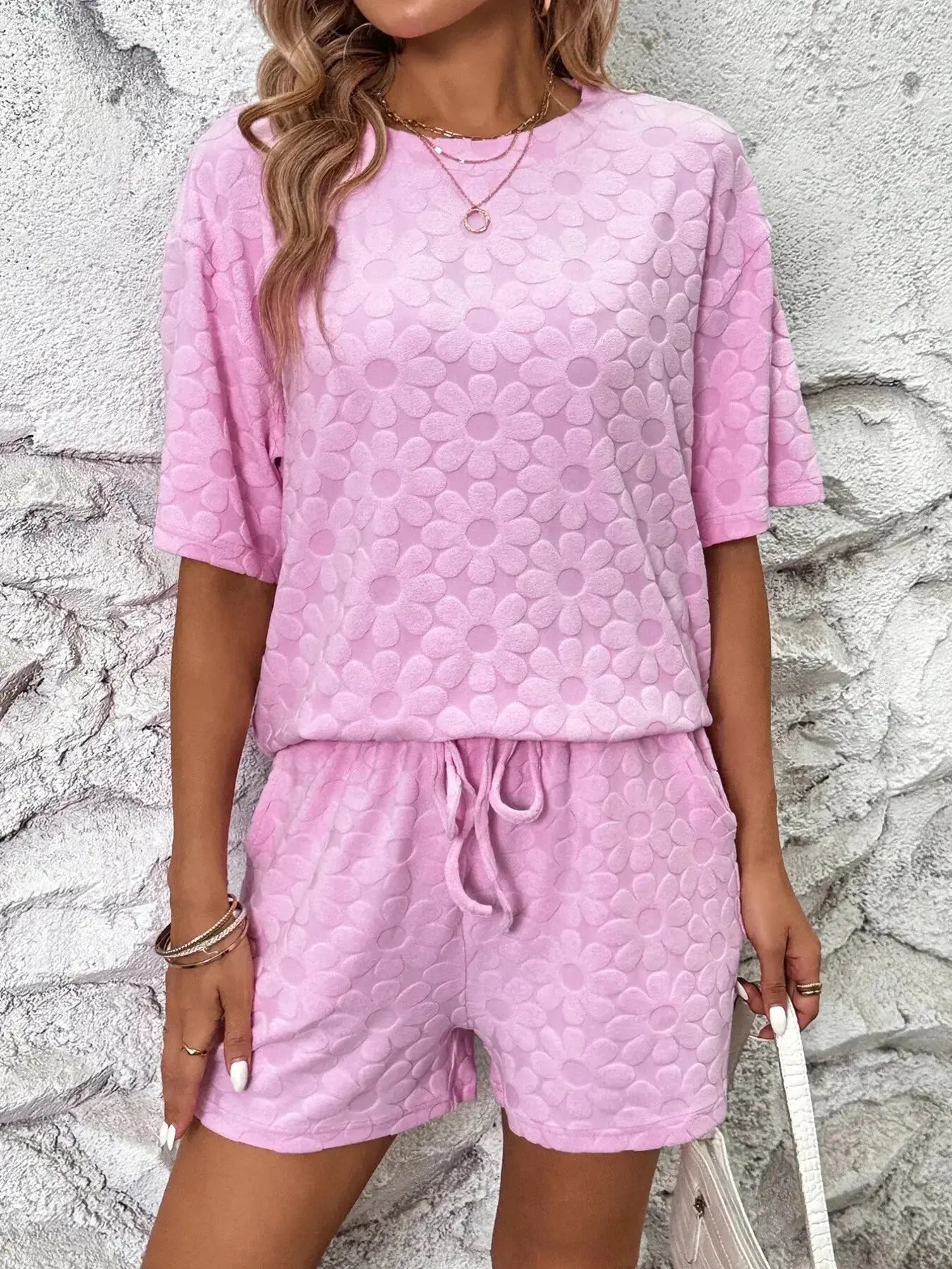 Floral print round neck top and matching shorts lounge pajamas set by Trendsi, featuring soft fabric and comfortable fit.