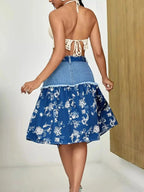 Floral print tiered denim skirt with frayed hem by Trendsi, showcasing a stylish layered design and casual denim fabric.