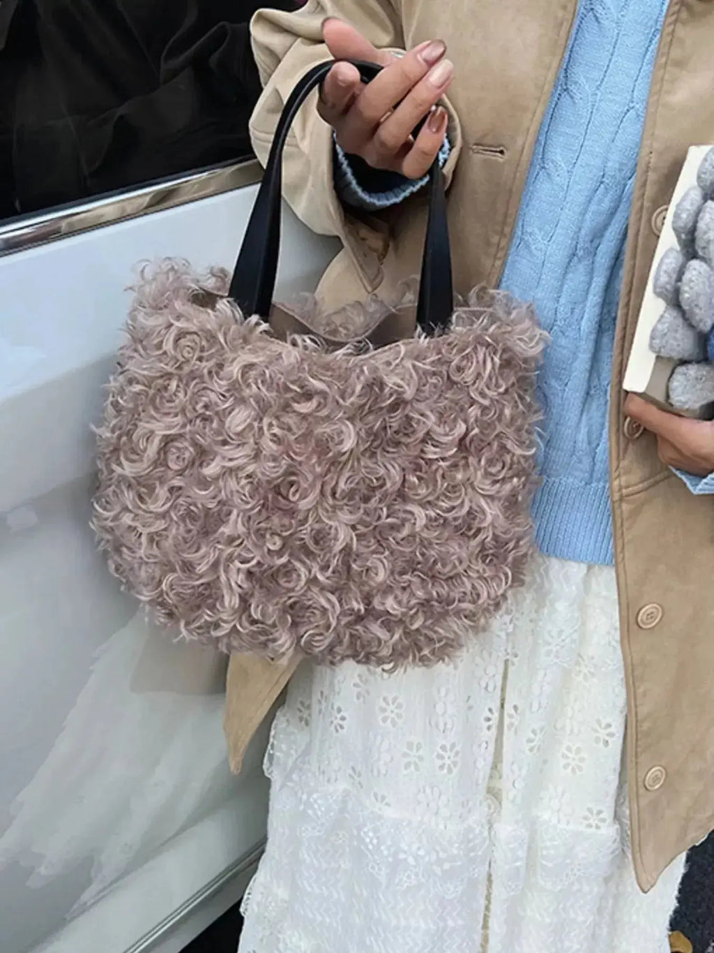 Lightweight fluffy plush shoulder bag by Trendsi with soft faux fur exterior, stylish handbag for everyday use.