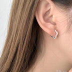Sterling silver four-leaf clover stud earrings with detailed leaf design, perfect for lucky jewelry accessories.
