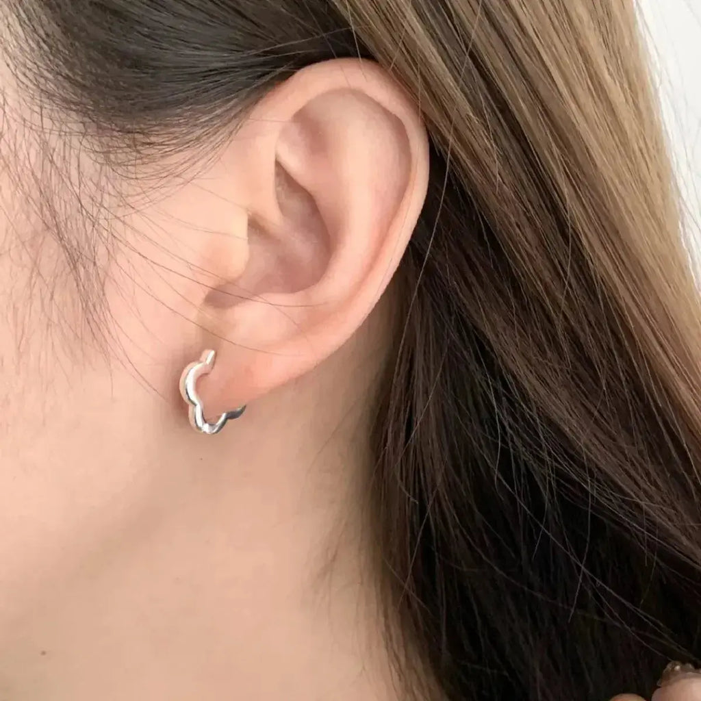 Four-leaf clover sterling silver stud earrings featuring a lucky four-leaf clover design, perfect for jewelry and earrings collection.