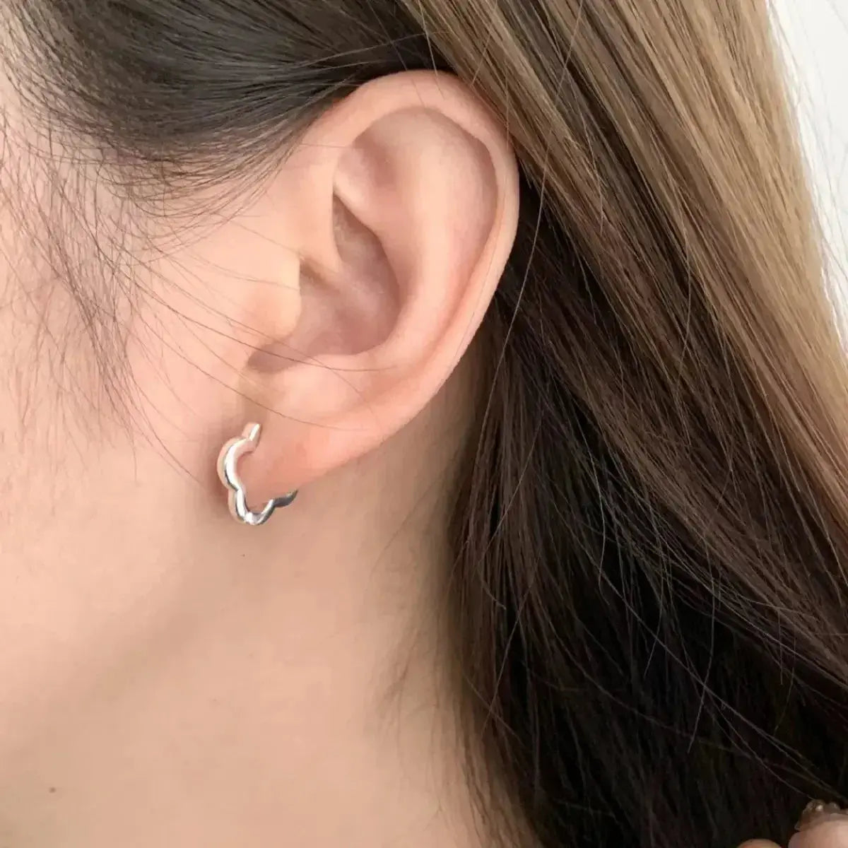 Four-leaf clover sterling silver stud earrings featuring a lucky four-leaf clover design, perfect for jewelry and earrings collection.