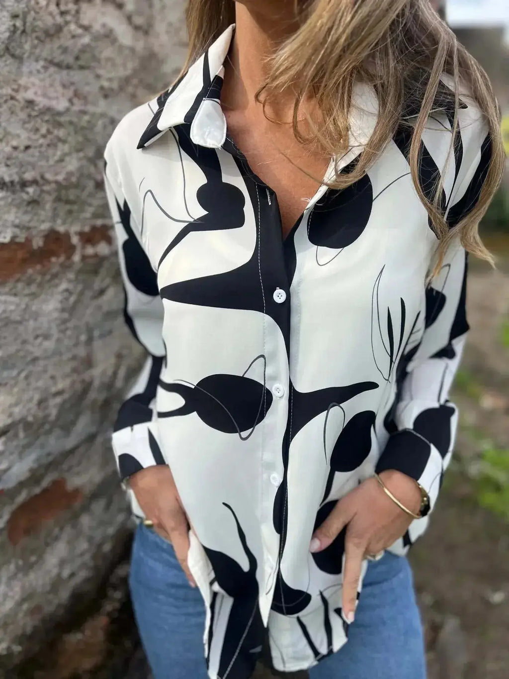 Plus size women's abstract print long sleeve button-up shirt by Plush Fashion Hub, featuring a stylish stretch fit design.
