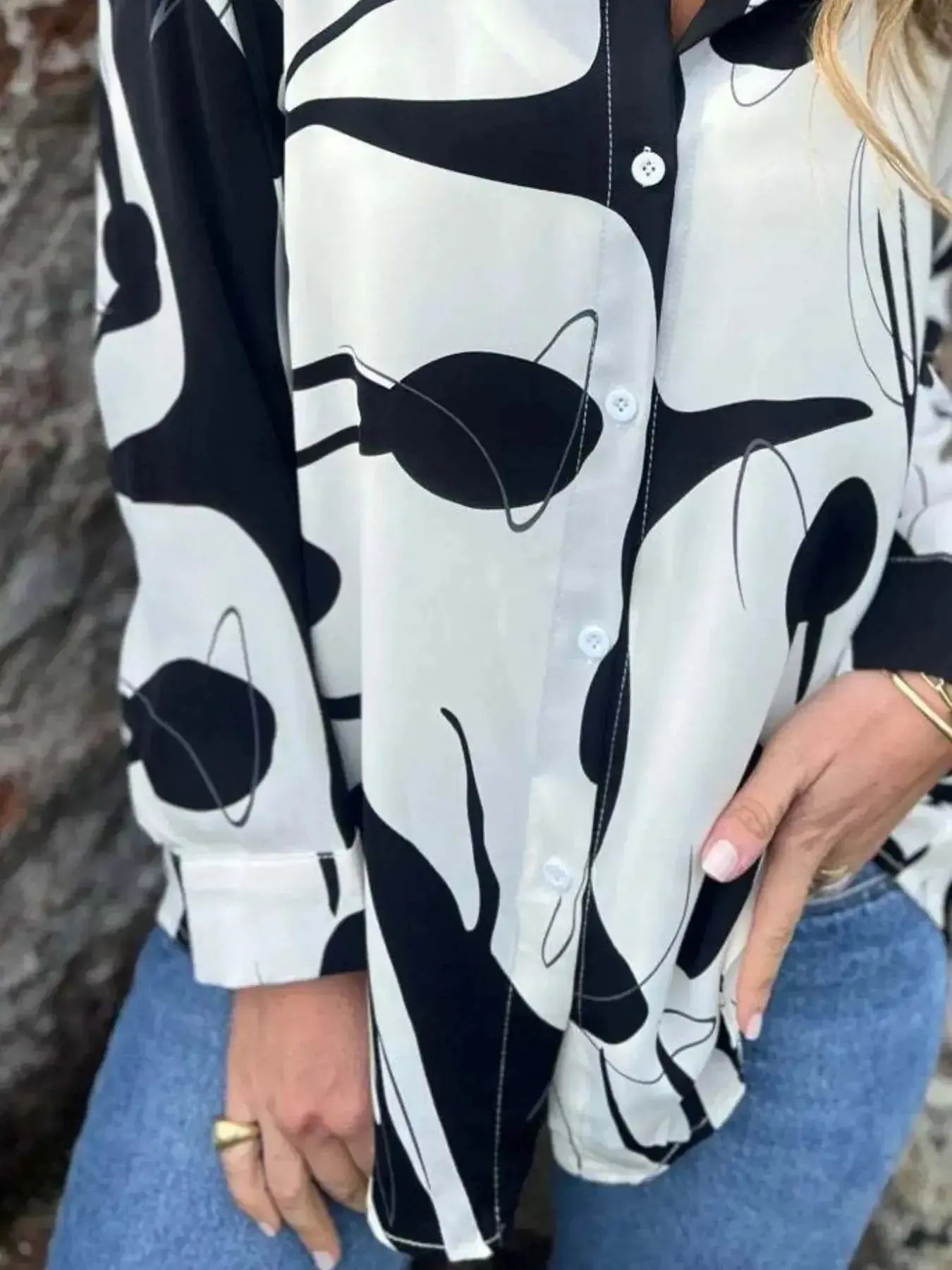 Plus size women's abstract print long sleeve button-up shirt by Plush Fashion Hub, featuring a stretch fit and stylish design.