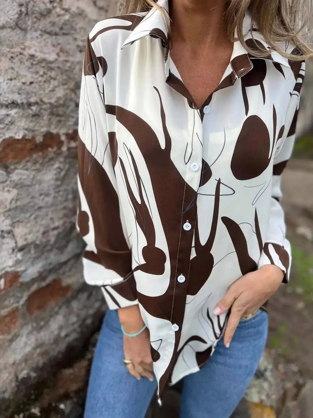 Plus size women's abstract print long sleeve button-up shirt by Plush Fashion Hub, featuring a stretch fit and stylish design.