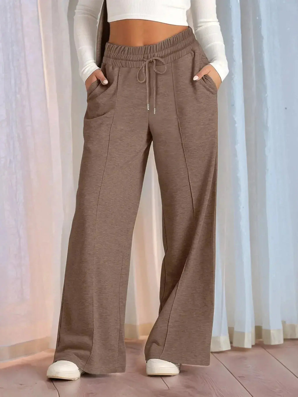 Plus size women's relaxed fit wide-leg drawstring pants by Plush Fashion Hub, comfortable lounge trousers with a full-length design.