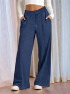 Plus size women's relaxed fit wide leg drawstring pants by Plush Fashion Hub, comfortable lounge trousers in full view.