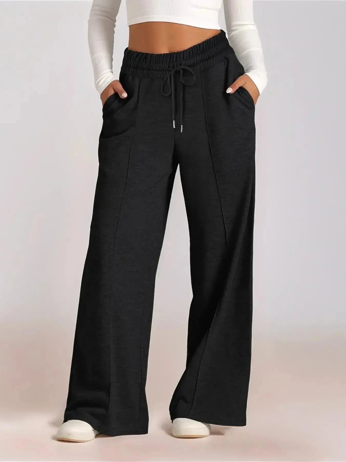 Plus size women's relaxed fit wide leg drawstring pants by Plush Fashion Hub, comfortable lounge trousers with a relaxed silhouette.