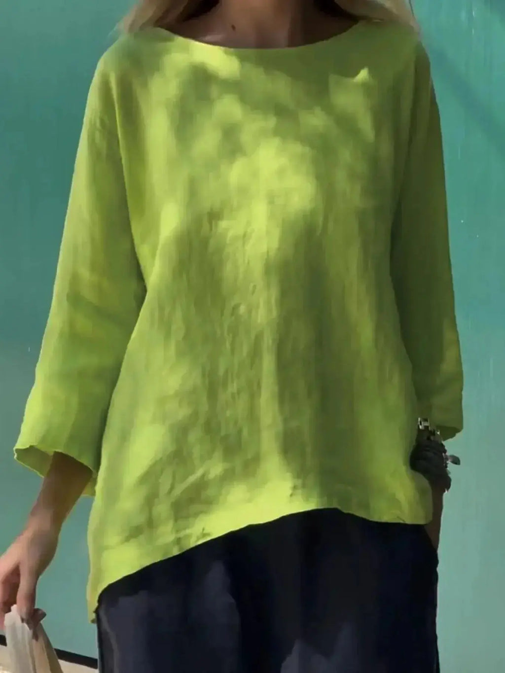 Full-size women's relaxed fit round neck casual blouse by Plush Fashion Hub, soft stretch fabric, perfect for everyday wear.