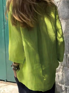 Full-body view of a woman's relaxed fit round neck casual blouse from Plush Fashion Hub, made of soft stretch fabric.