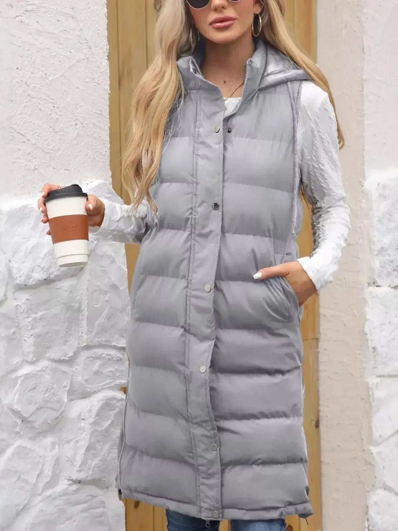 Women's longline padded hooded vest by Plush Fashion Hub, lightweight sleeveless jacket with snap-down hood and cozy padding.