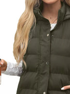 Full-length women's padded hooded vest by Plush Fashion Hub, lightweight sleeveless jacket with snap-down front and cozy design.