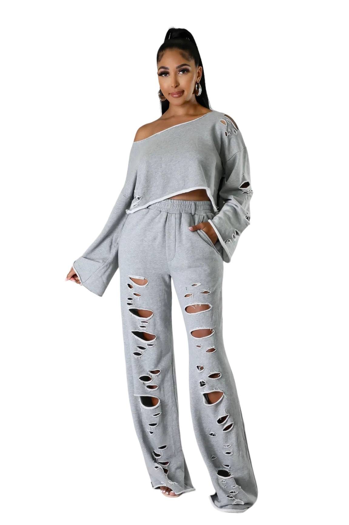 Two-piece off-the-shoulder distressed pants set by The House of Stylez, featuring a stylish, tall girl-friendly design and casual fit.