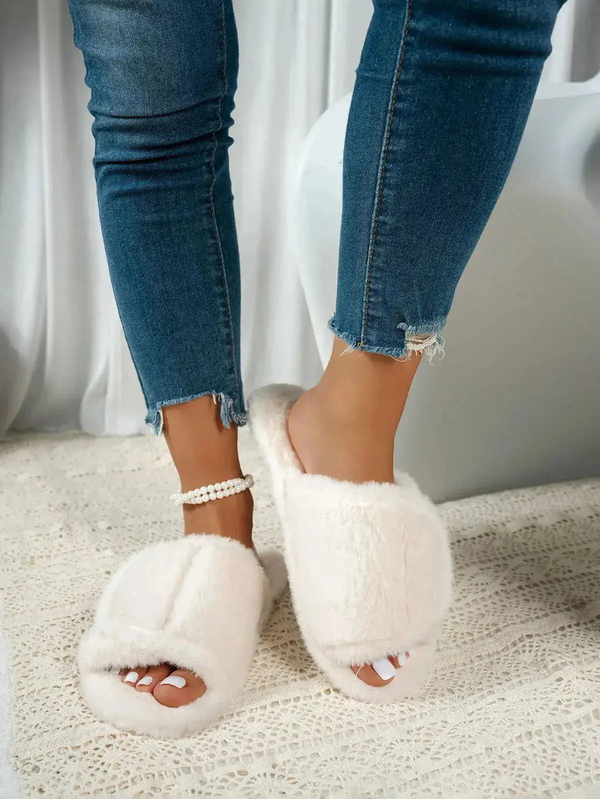 Soft plush open-toe slippers with fuzzy texture and rubber sole, ideal for indoor comfort from Plush Fashion Hub.