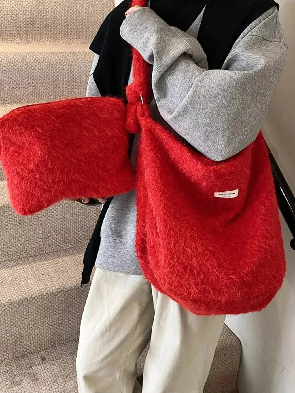 Fuzzy solid color crossbody bag from Plush Fashion Hub with plush fabric and adjustable strap, perfect for casual wear.