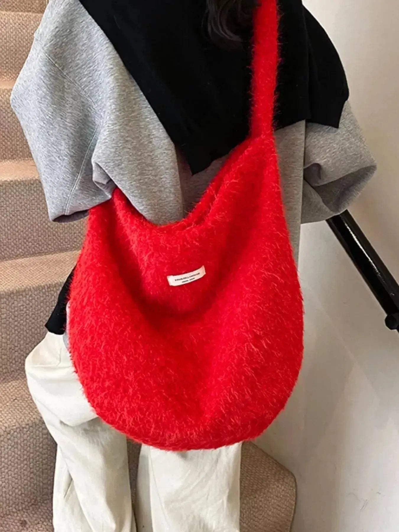 Soft fuzzy solid color crossbody bag by Plush Fashion Hub featuring plush material and minimalist design.