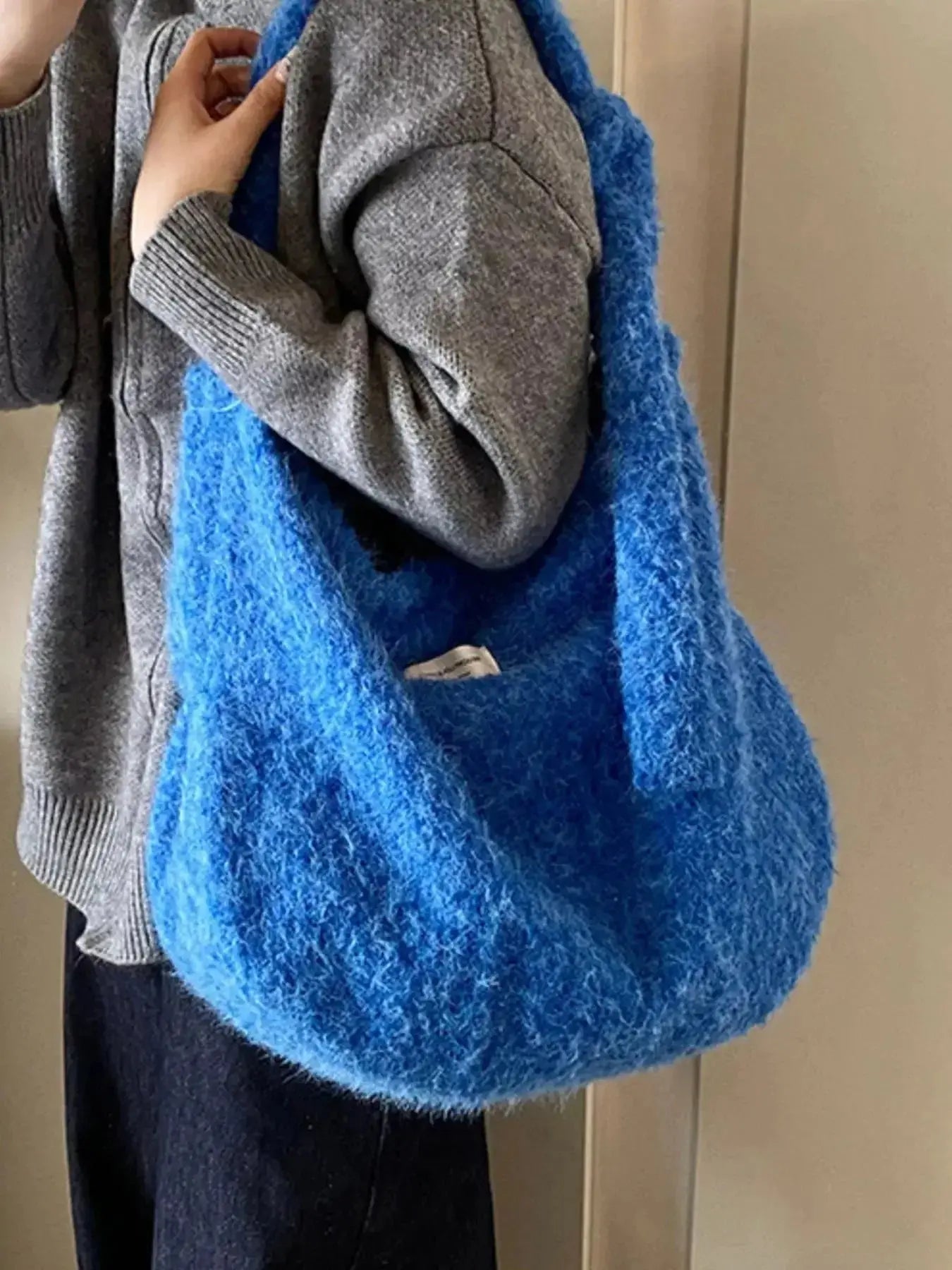 Fuzzy solid color crossbody bag by Plush Fashion Hub featuring plush material and simple design for casual wear.