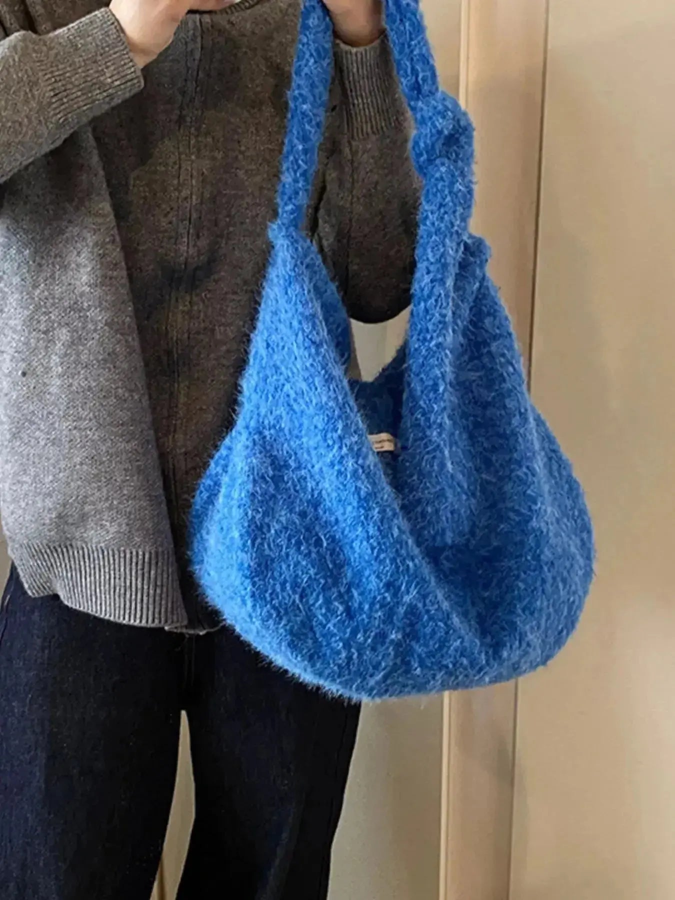Fuzzy solid color crossbody bag by Plush Fashion Hub with plush texture and adjustable strap, perfect for casual wear.