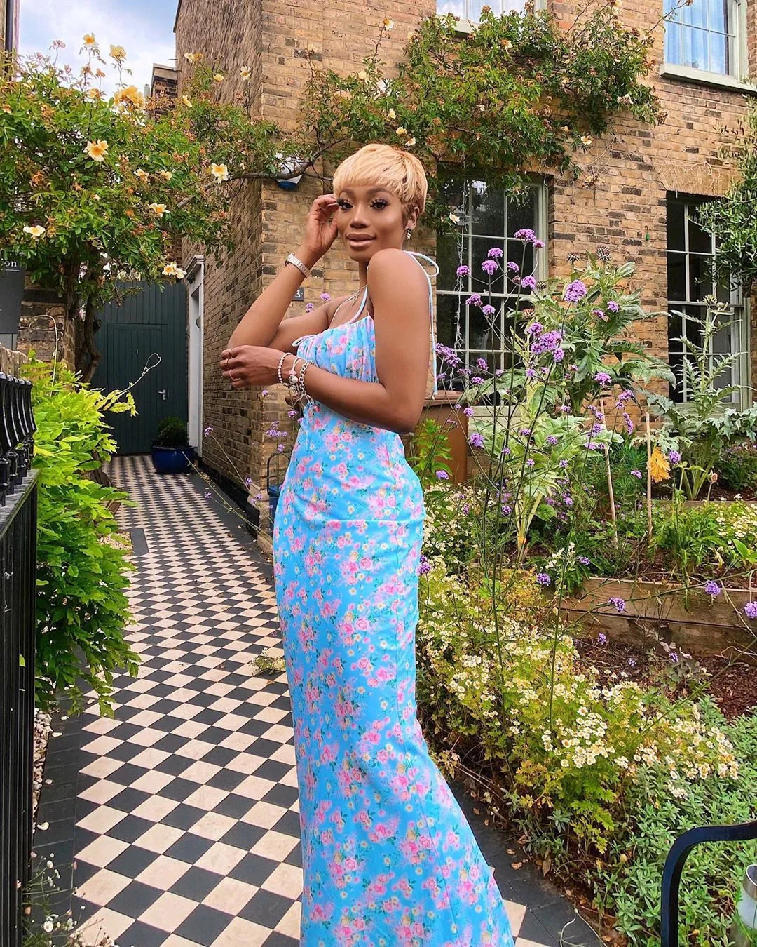 Elegant floral pleated maxi evening dress for women by Plush Fashion Hub, featuring intricate floral patterns and flowing fabric.