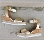 Women's wedge heel sandals with buckle strap by Trendy Attic Store01, featuring open toes and stylish design.